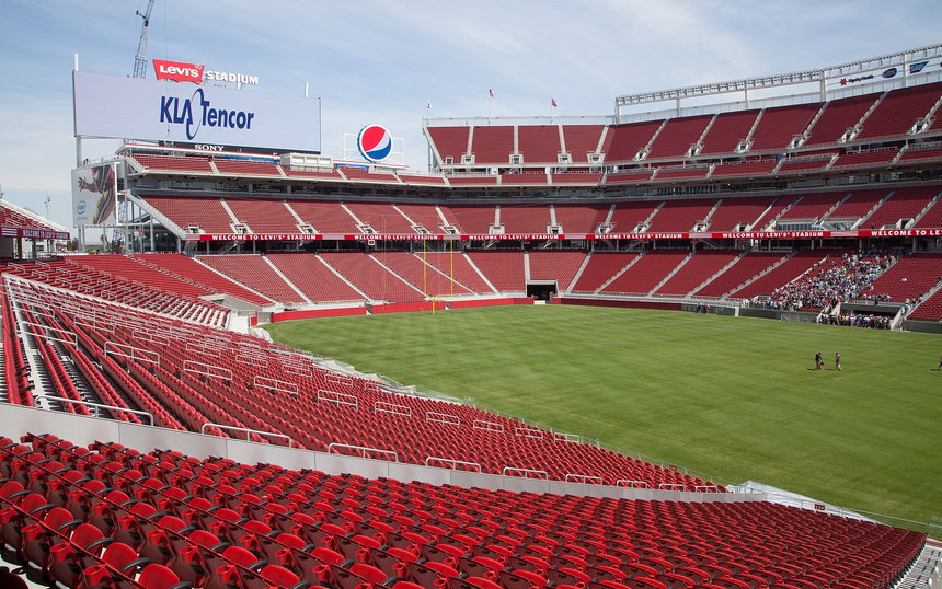 The empty red seating bowl of Levi's Stadium above the field